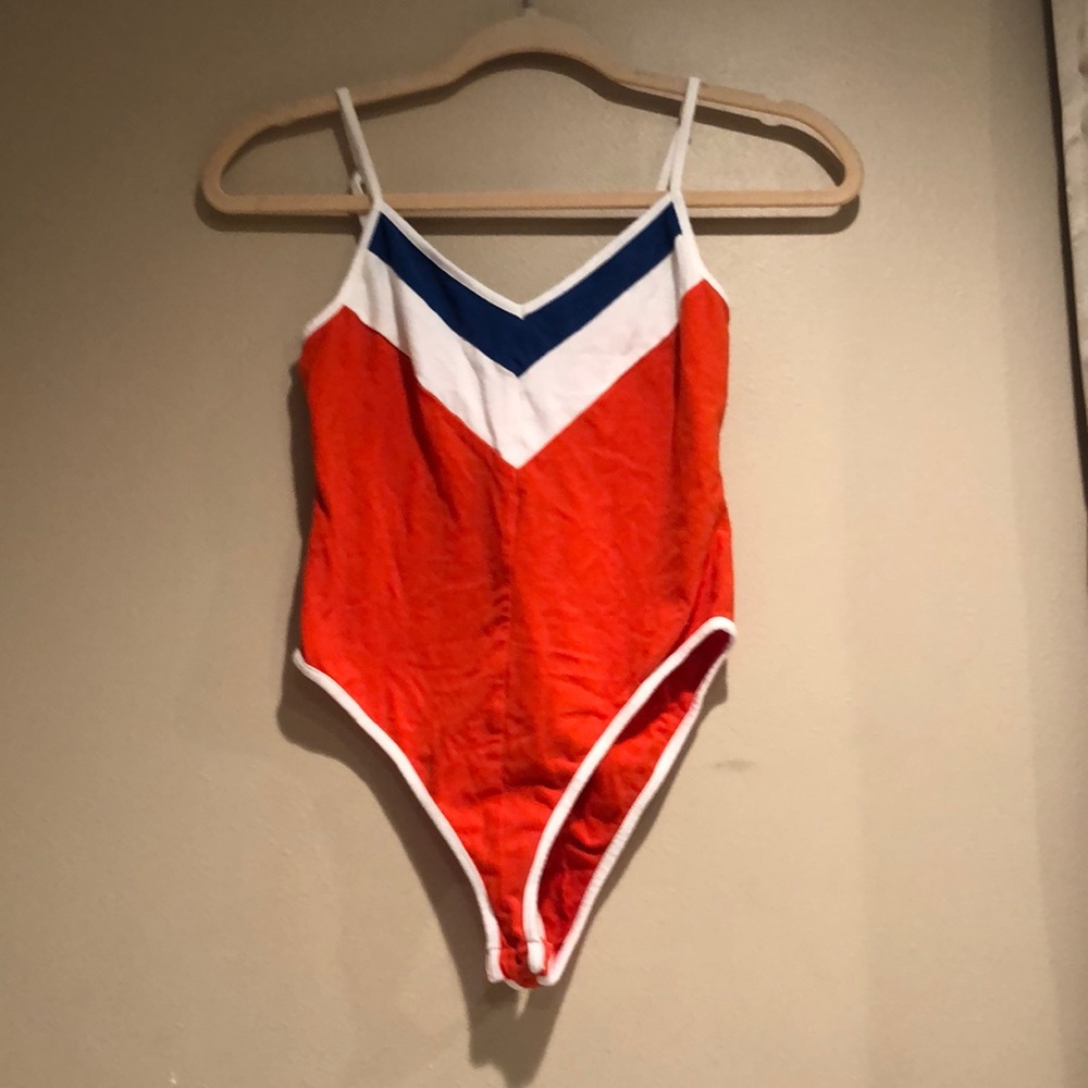 Orange,blue, white body suit